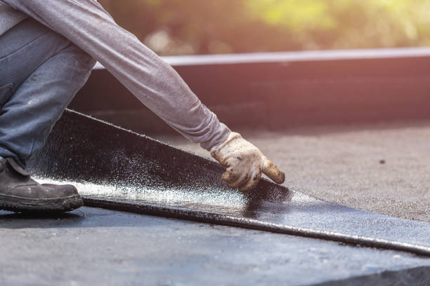 Professional Basement Waterproofing technician working in Wheaton, MD